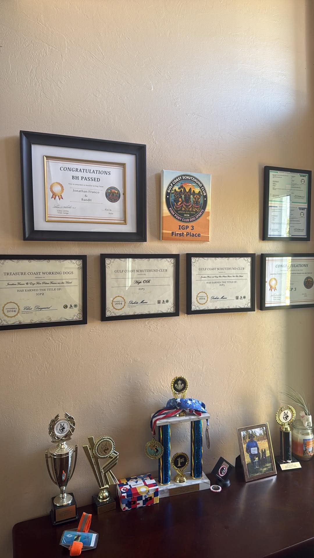 Jonathan Franco championship wall — BH, IGP2, IGP3, High OB titles and trophies